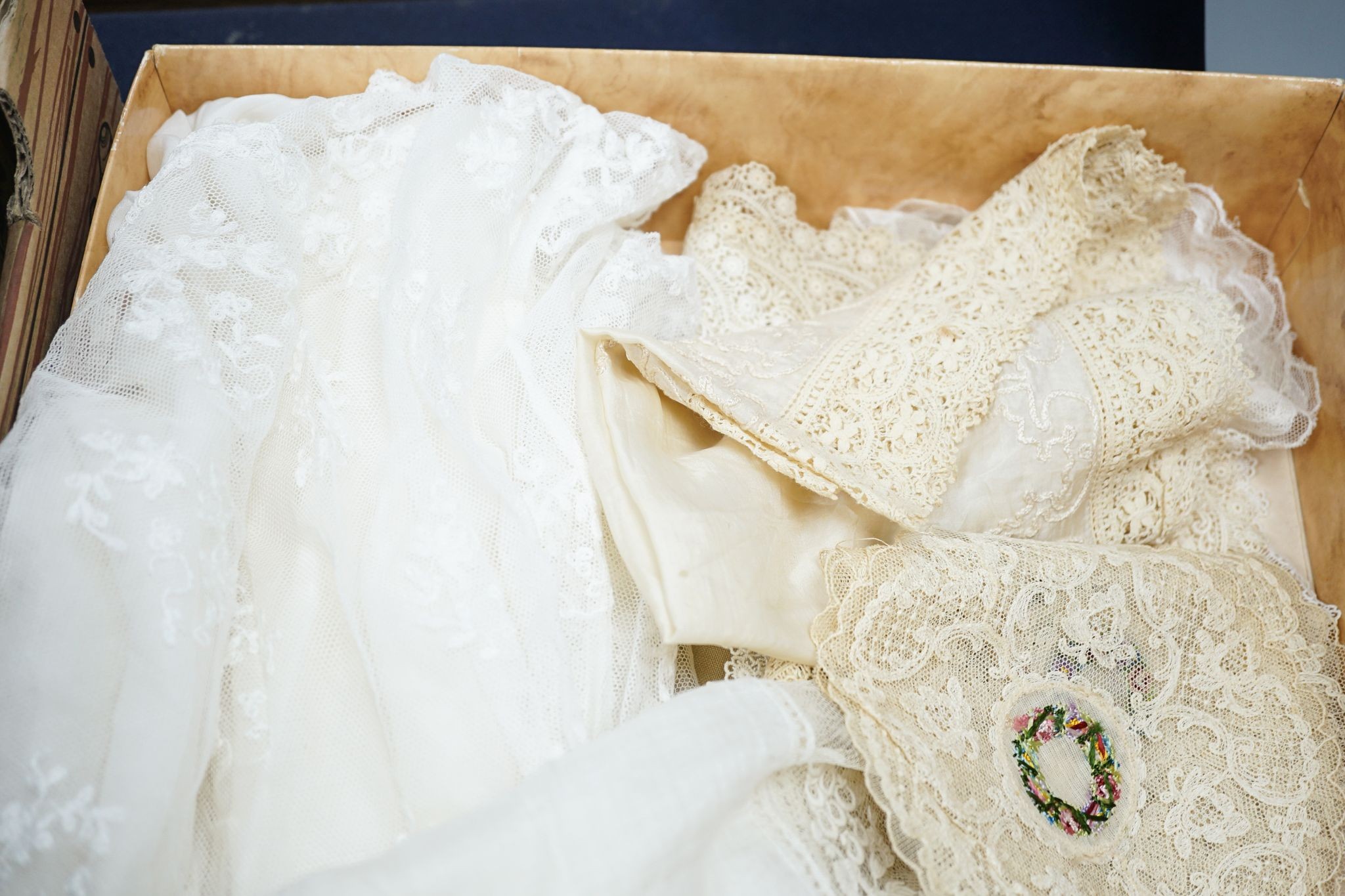 Two early 19th century, finely white worked lace hankies, various sets of lace mats and a lace baby dress, Hankies 40 cms x 40 cms.